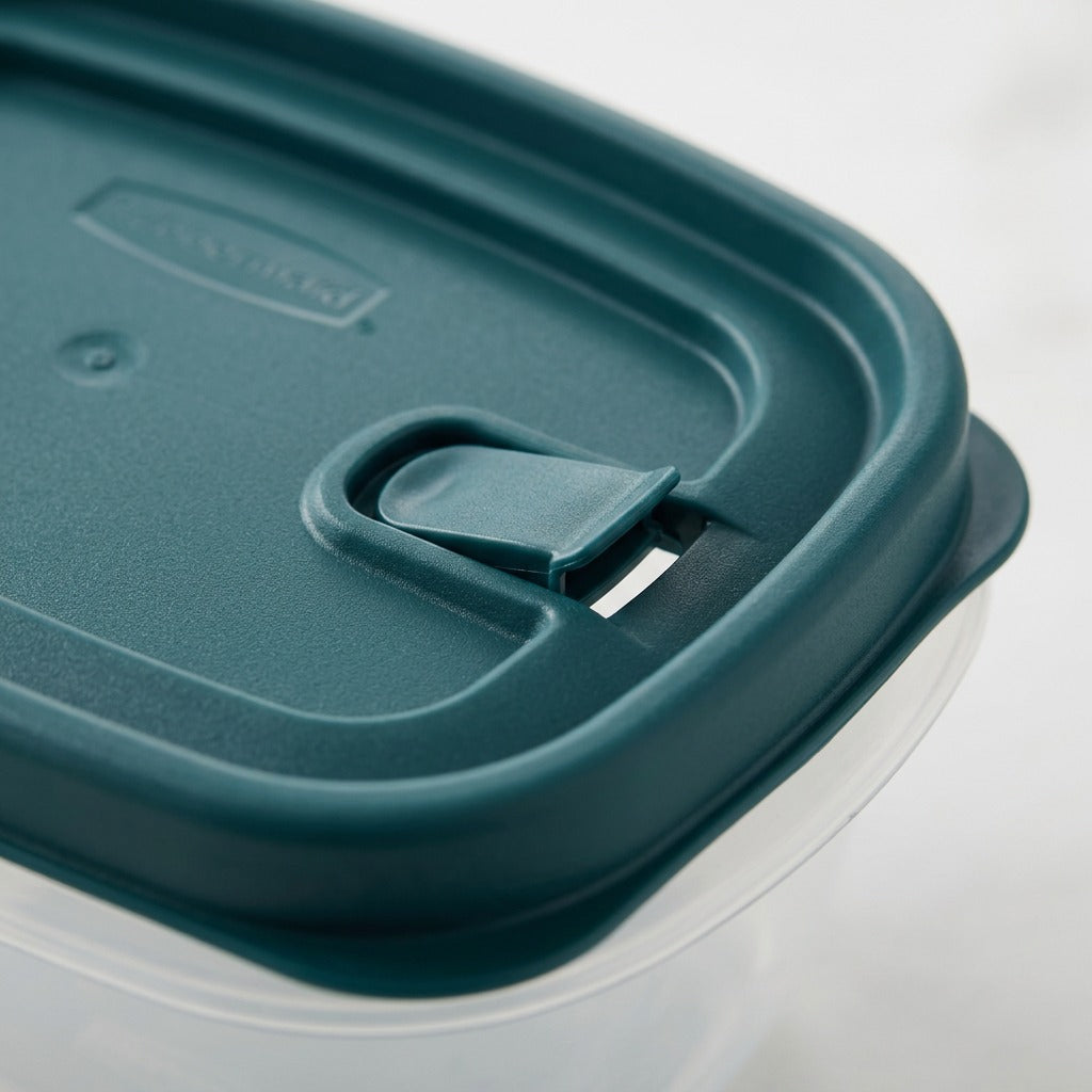 Close-up of a Rubbermaid Blue Spruce vented lid, showing the integrated steam vent and seal texture.