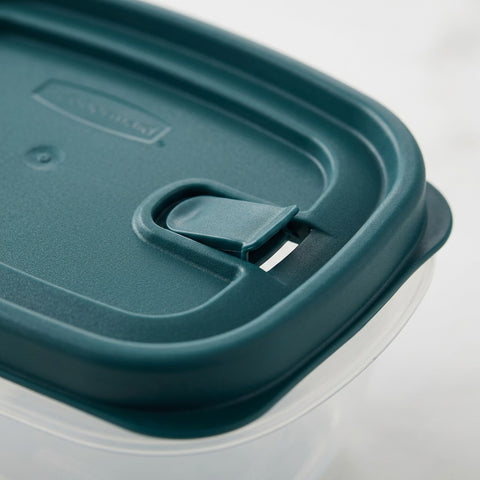 Close-up of a Rubbermaid Blue Spruce vented lid, showing the integrated steam vent and seal texture.